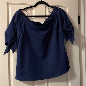 Olivia Grey off the shoulder navy top with bow accents on sleeves